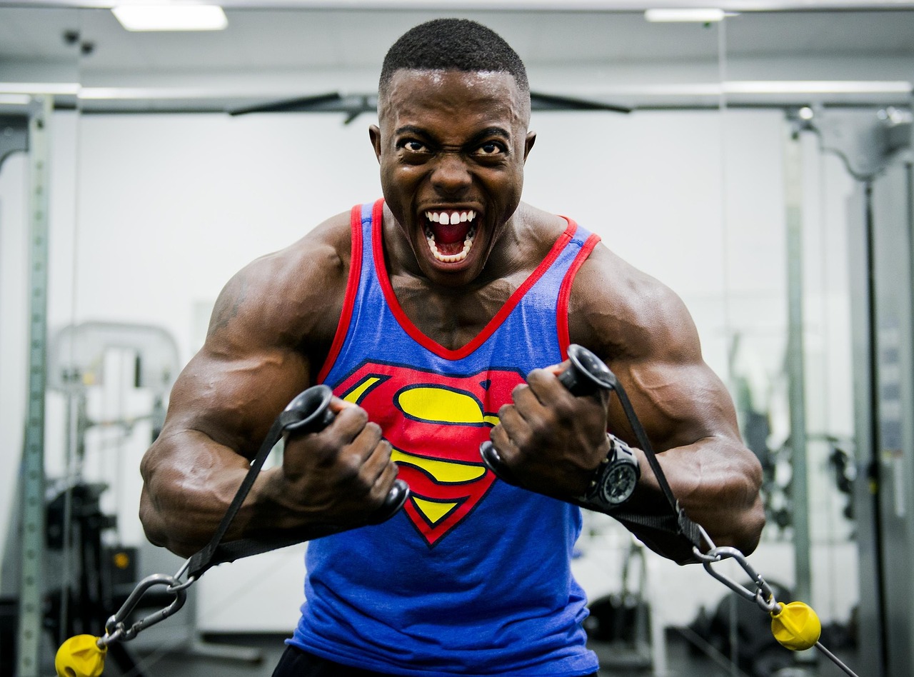 Energetic man doing cable exercises